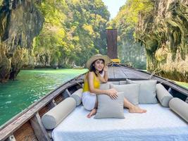 Woman tourist in private longtail boat trip to Lagoon koh hong near Hong island, Krabi, Thailand. landmark, destination, Asia Travel, vacation, wanderlust and holiday concept photo