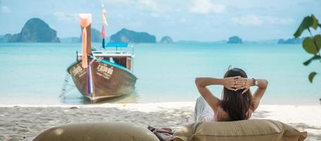 Woman tourist rest on Beautiful beach Island at summer. destination, wanderlust, Asia Travel, tropical summer, vacation and holiday concept photo