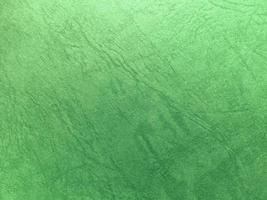 Green paper texture background with pattern for design. Copy space for text and work photo