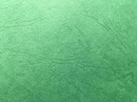 Green paper texture background with pattern for design. Copy space for text and work photo