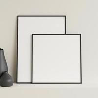 Minimalist front view black photo or poster frame mockup leaning against wall on table with vase. 3d rendering.