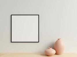 Clean and minimalist front view square black photo or poster frame mockup hanging on the wall with vase. 3d rendering.