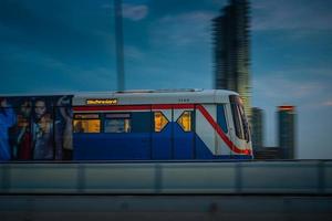 Bangkok, Thailand  May 29  BTS Sky Train Passing Taksin Bridge Saphan Taksin or Saphan Sathorn in the Evening on May 29, 2022 in Bangkok, Thailand. photo