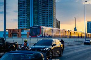 Bangkok, Thailand  May 29  BTS Sky Train Passing Taksin Bridge Saphan Taksin or Saphan Sathorn in the Evening on May 29, 2022 in Bangkok, Thailand. photo