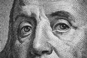 Hundred dollar bill macro texture, Franklin eyes closeup photo