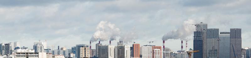 Cityscape smoking plant chimneys, urban landscape, large city skyline panorama photo