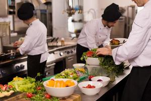 team cooks and chefs preparing meal photo