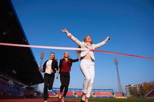 business people running on racing track photo