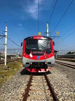 Surakarta - Indonesia, August 2022. Electric train with red and white flags on the occasion of Indonesia's independence day photo