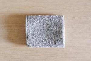 Wipe towel fold on wood table. photo
