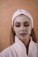 Spa Woman applying Facial Mask photo