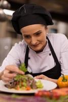 cook chef decorating garnishing prepared meal photo