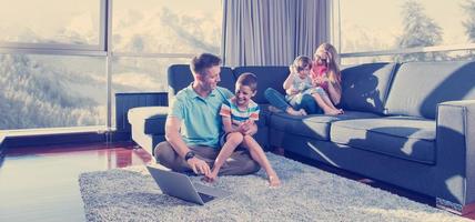 Happy family playing a video game photo