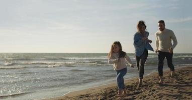 Young family enjoying vecation during autumn photo