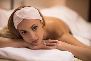 woman laying on massage table photo