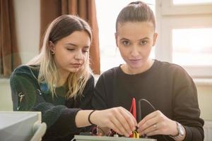 students doing practice in the electronic classroom photo