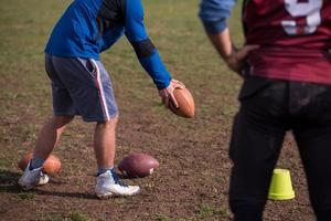 american football team with coach in action photo