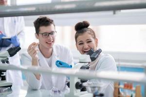 Group of young medical students doing research photo