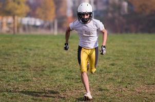 american football player in action photo