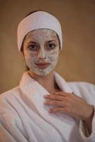 Spa Woman applying Facial Mask photo