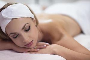 woman laying on massage table photo