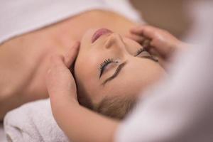 woman receiving a head massage photo