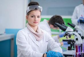 Group of young medical students doing research photo