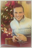 Happy young man with a glass of champagne photo