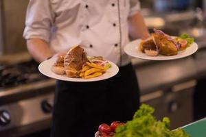 Chef showing dishes of tasty meals photo