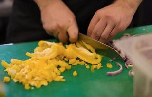 Chef cutting fresh and delicious vegetables photo