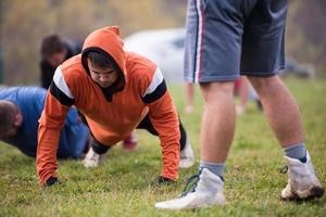 american football team doing push ups photo