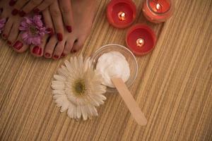 female feet and hands at spa salon photo