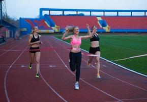 Female Runners Finishing Race Together photo