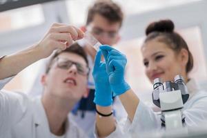 Group of young medical students doing research photo