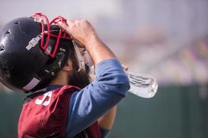 american football player drinking water after hard training photo