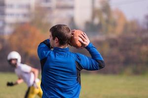 american football team with coach in action photo