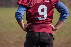 american football player resting after hard training photo