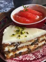 Refreshing healthy dessert made from ice and grapefruit. carrot cake with cream. background and interior. photo