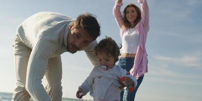 Young family enjoying vecation during autumn photo