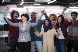 portrait of young excited multiethnics business team photo