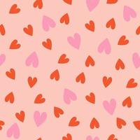 Seamless pattern with pink and red hearts. Vector graphics.