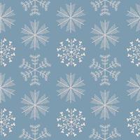 Seamless pattern with different snowflakes. Snow on a blue background. Vector illustration in flat style