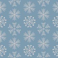 Seamless pattern with different snowflakes. Snow on a blue background. Vector illustration in flat style