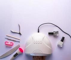 drying of nails in an ultraviolet lamp photo