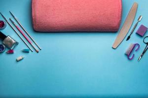 Top view of manicure and pedicure equipment on blue background photo