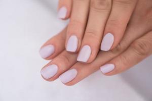 woman fingers with french manicure photo