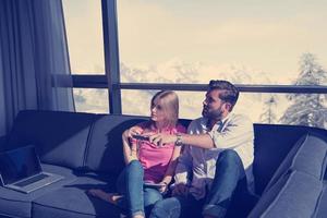 Young couple watching television photo