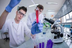 Group of young medical students doing research photo