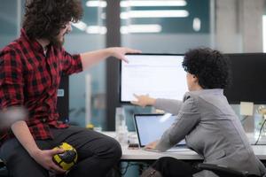 software developers couple writing programming code photo