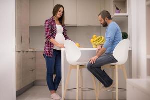 couple cooking food fruit lemon juice at kitchen photo